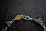 Bracelet avec ambres multicouleurs en forme de coccinelle
