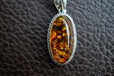 Pendentif ovale en argent 925 avec ambre cognac de la Mer Baltique